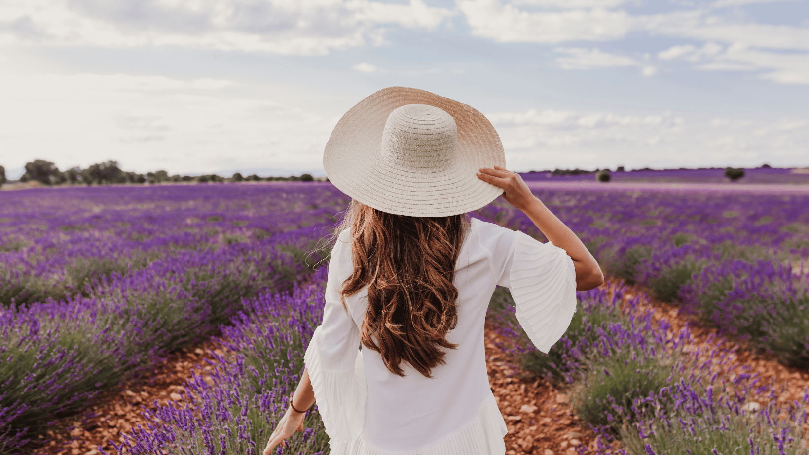 Woman with a sunhat in lavender field